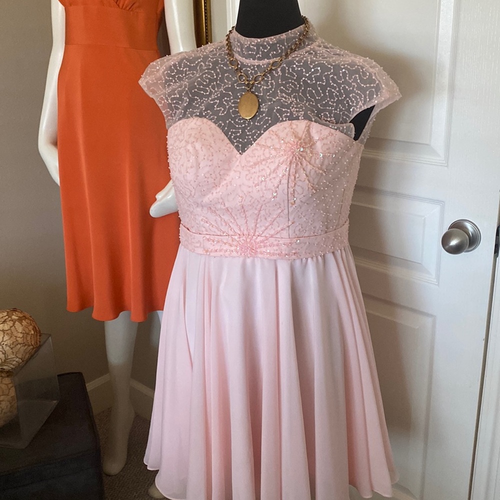 Swirl around in a beautiful pink dress by Hebeos!